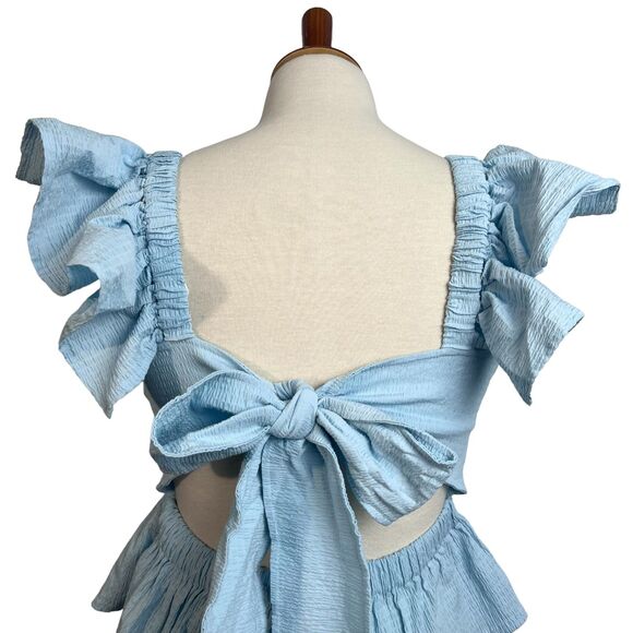 Anisa Peplum Jessie Bow Back Blouse in Light Blue by Francesca’s - Picture 11 of 16